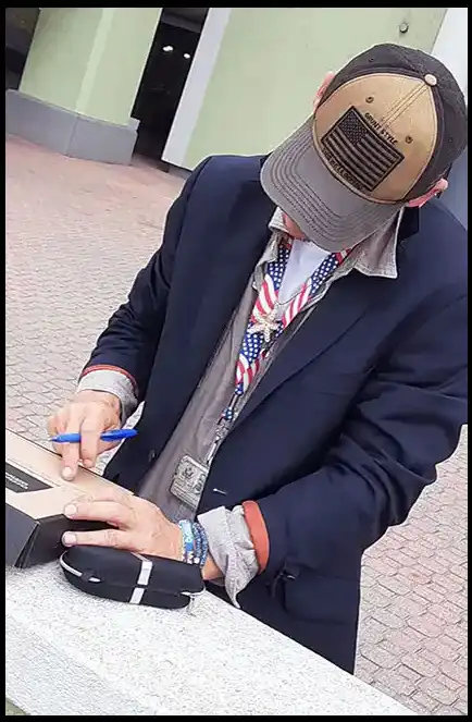 Book Author and Veteran David Haave signing his first copy of the Butterflies and Friendships book for the kids in Port Arthur Texas USA -- David Haave